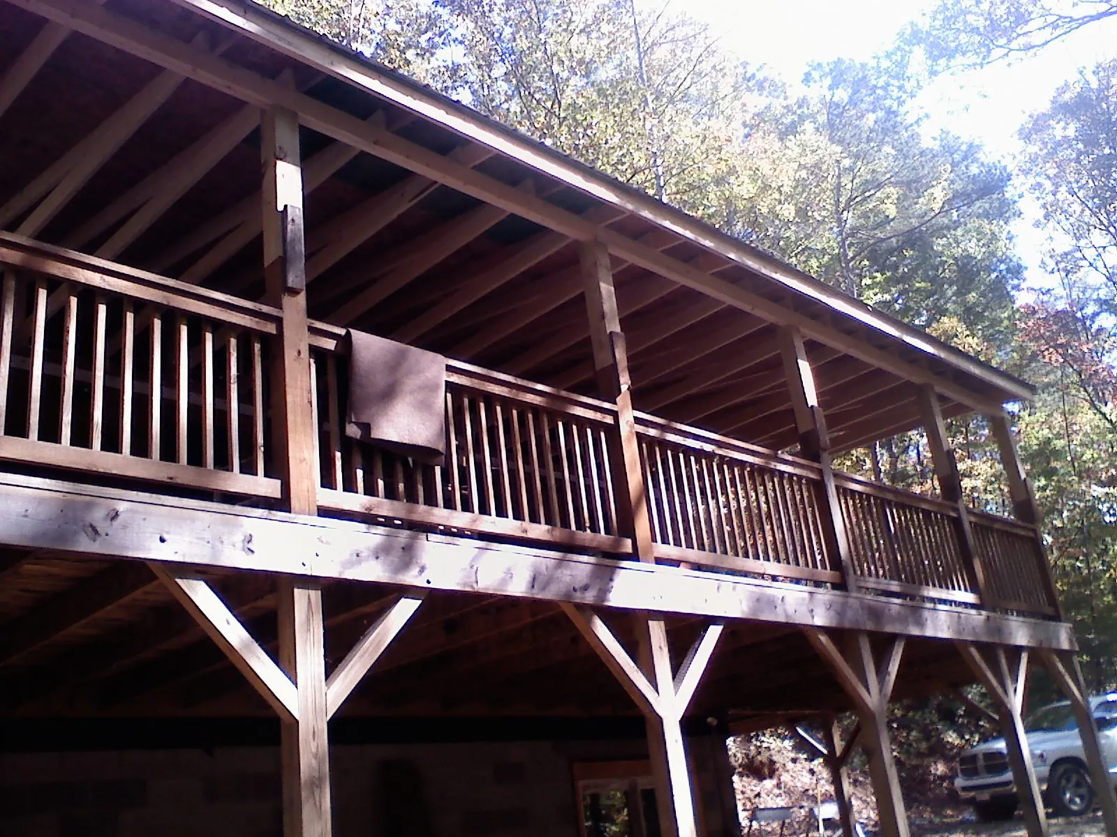 Timber framing under a new elevated porch and deck in Coldwater